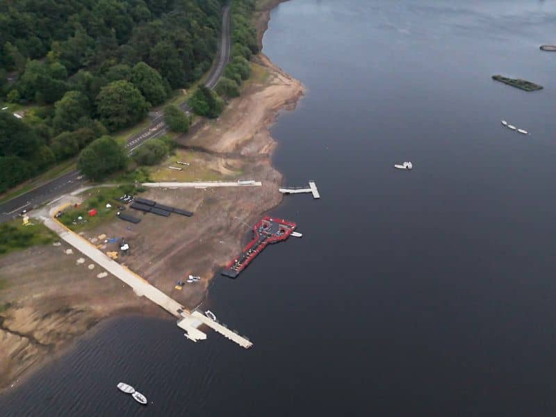 Aerial view of a lakefront commercial property with docks and shoreline improvements evaluated during an ALTA Survey